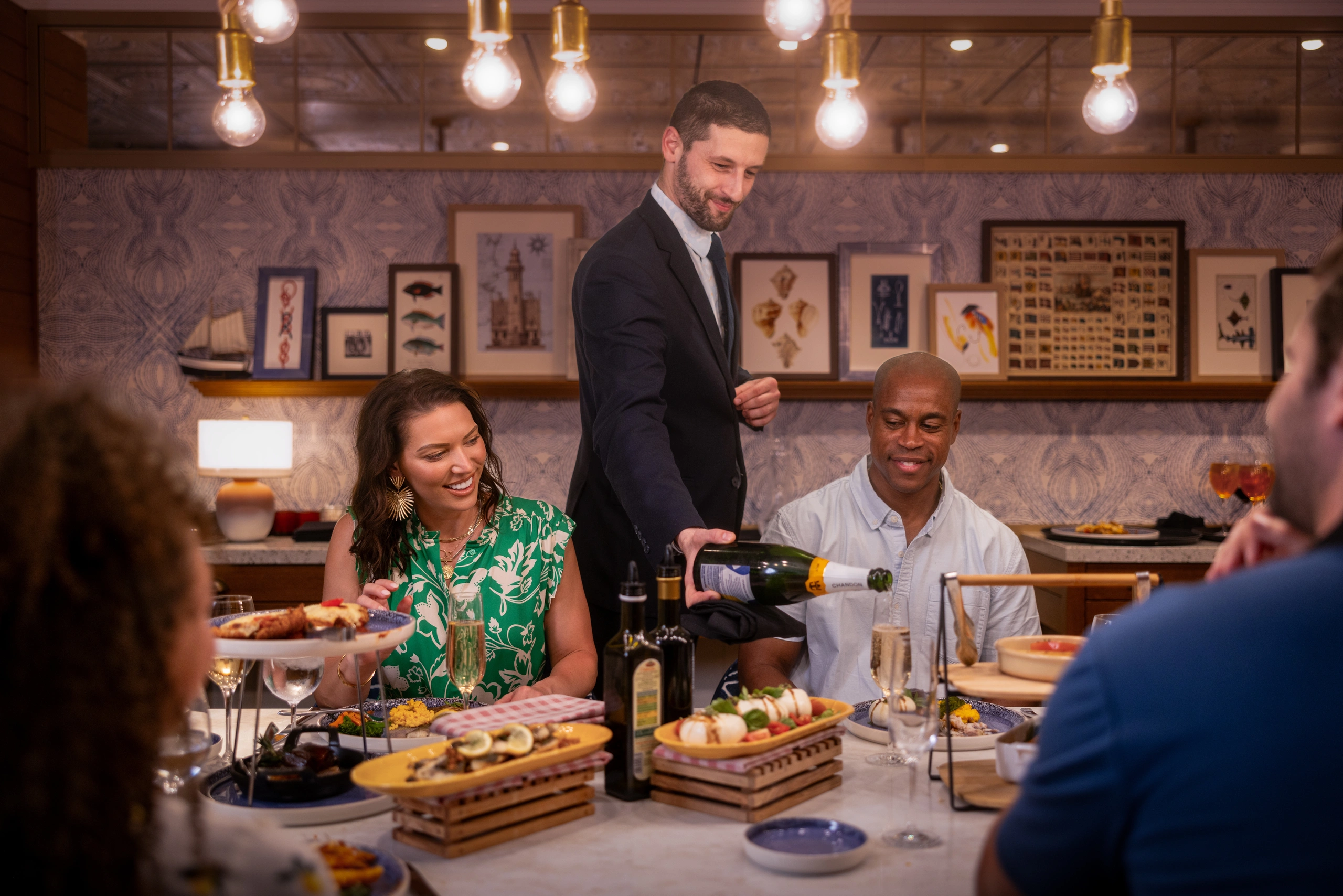 Waiter pouring champagne