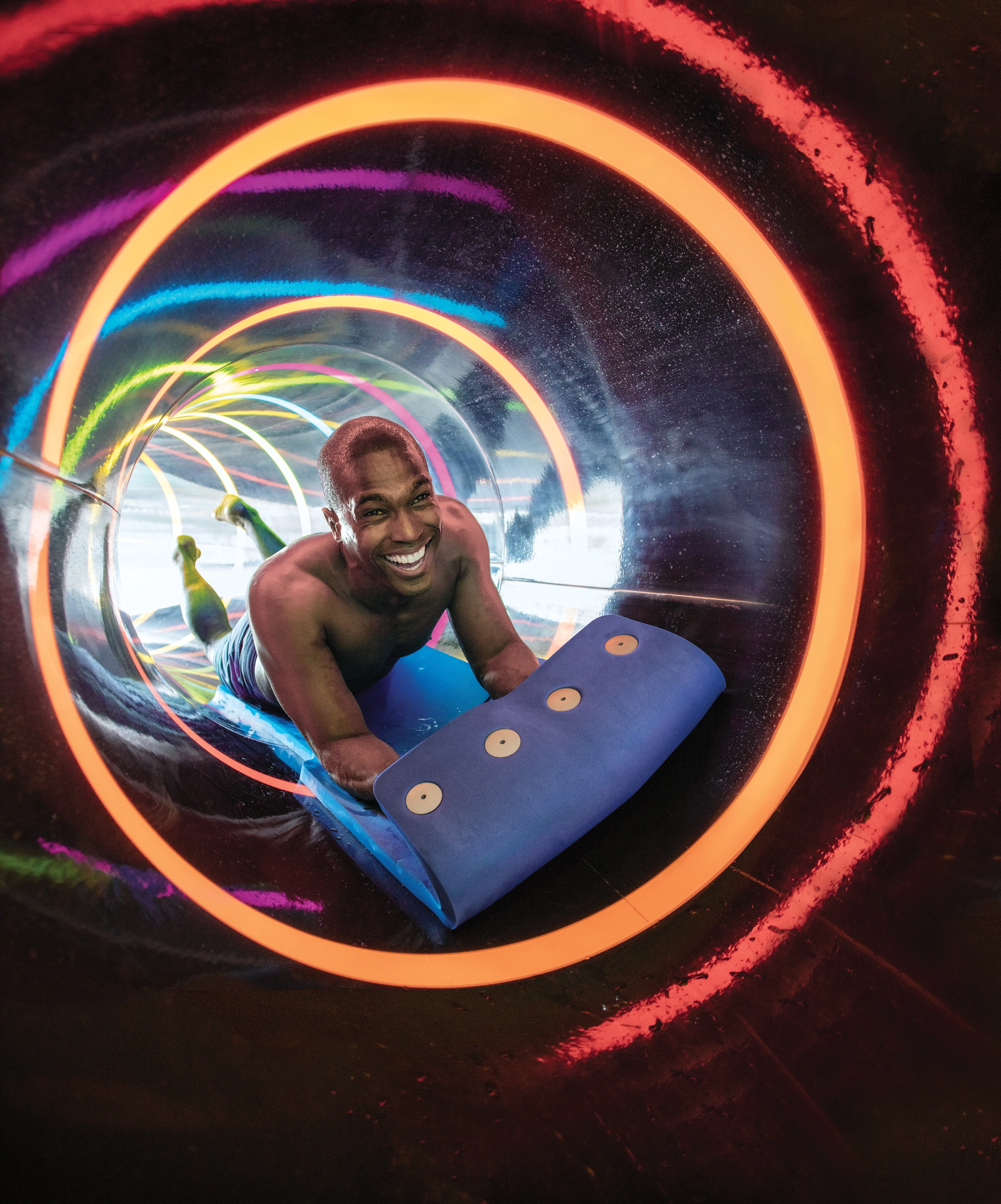 Man going down water slide