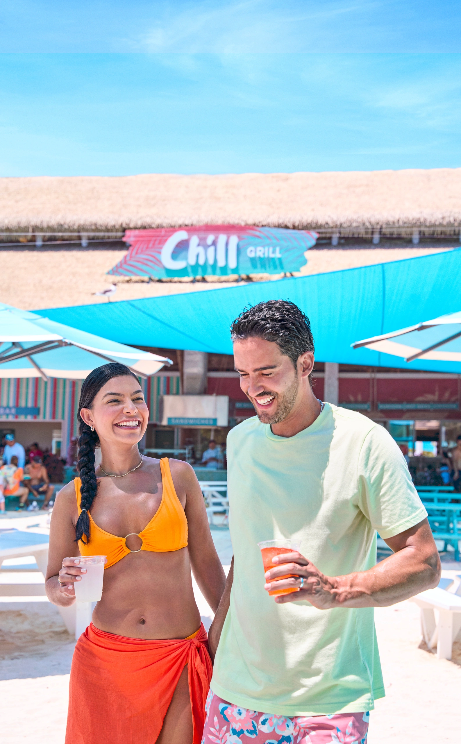 Couple with drinks at Perfect Day CocoCay