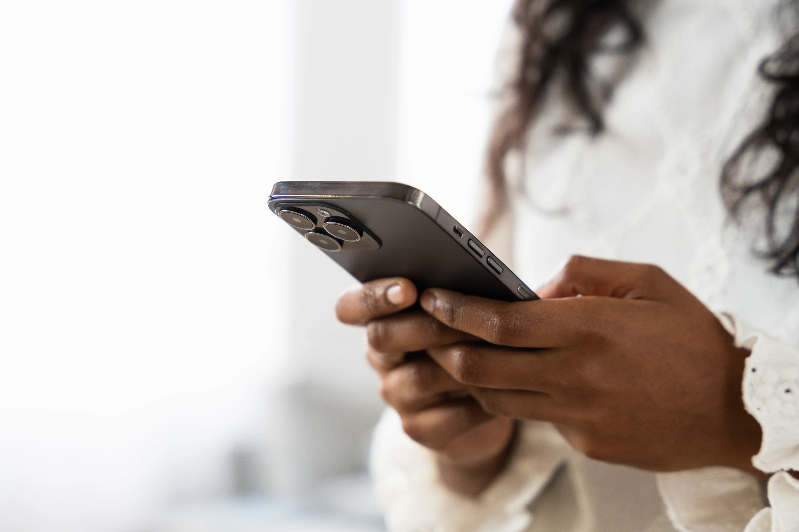 Closeup of woman on iphone